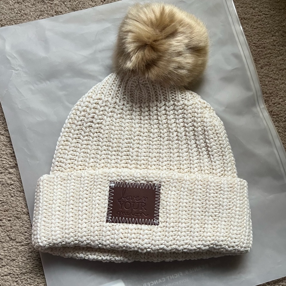 New, never word. Love Your Melon White Speckled Pom Beanie